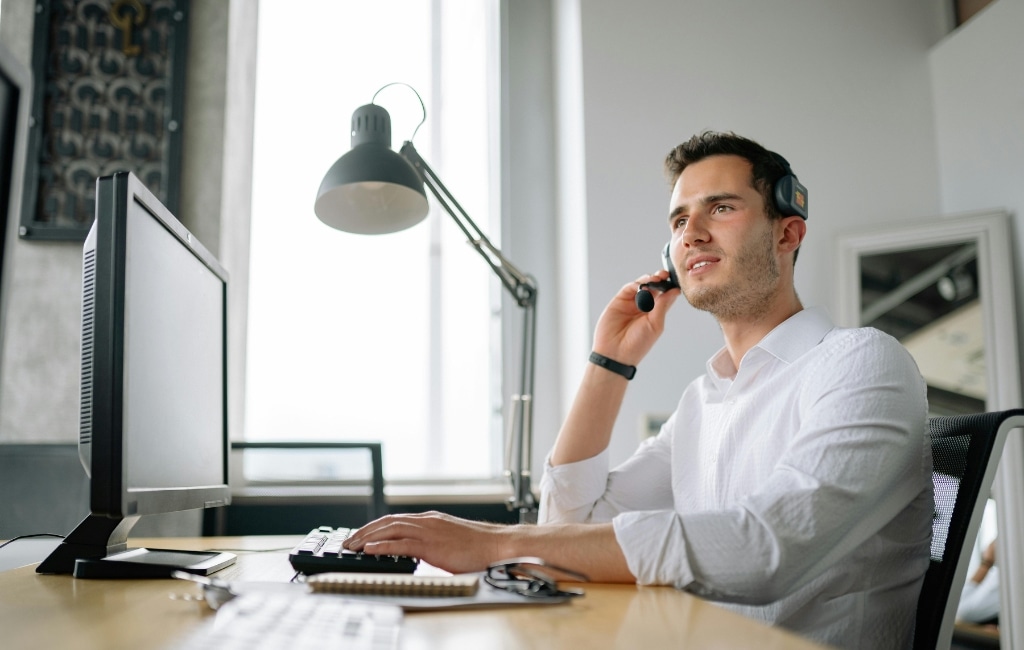 virtual receptionist working on a computer