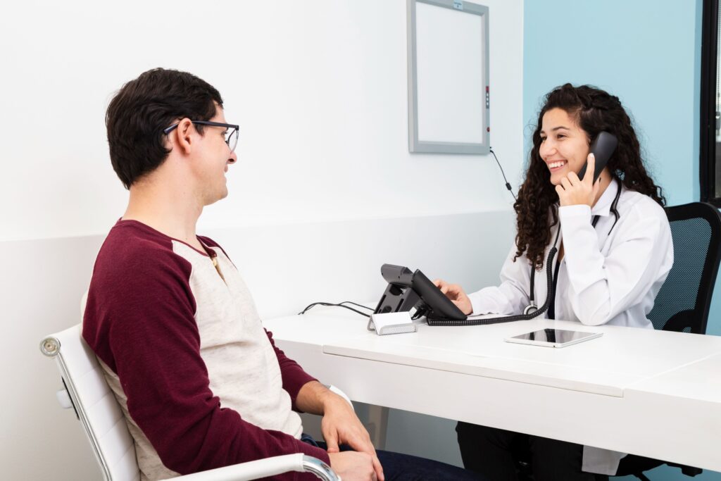 How to Leave a Positive Lasting Impression with a Virtual Receptionist 2 healthcare receptionist talking phone