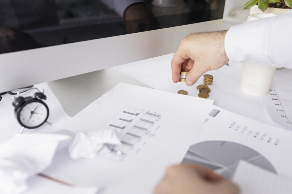 15 Tips for Small Businesses to Reduce Operational Costs 2 man working graphics his desk