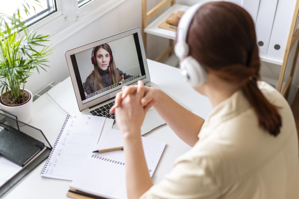 portrait woman work having video call laptop 1