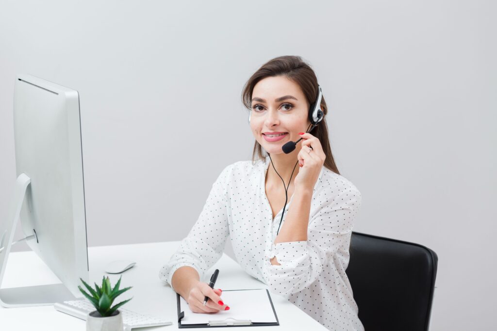 woman posing with headset desk