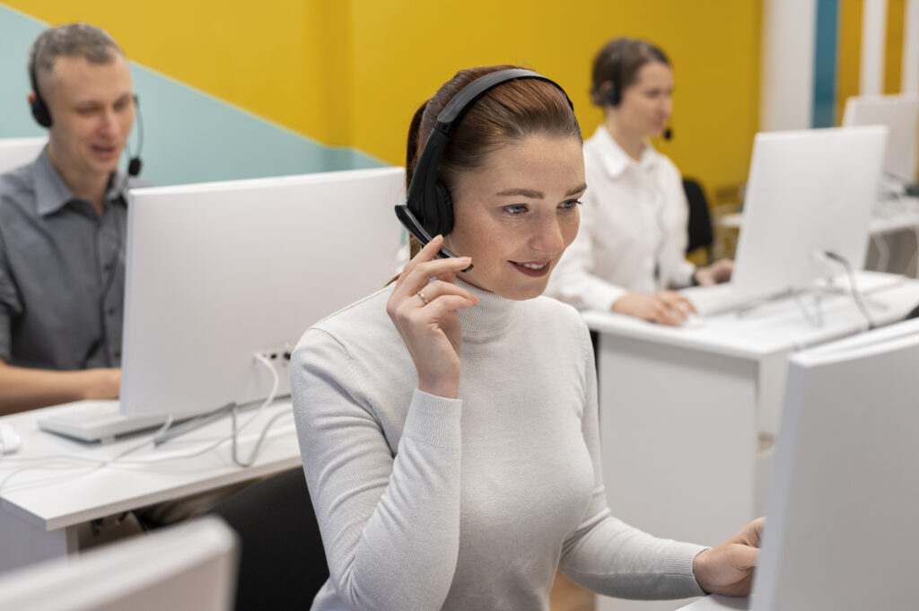 woman working call center talking with clients using headphones microphone